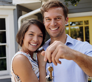 happy smiling couple with new mortgage